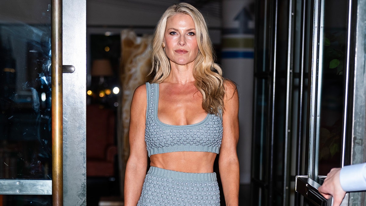 Ali Larter in a blue crop top and matching skirt in new york.