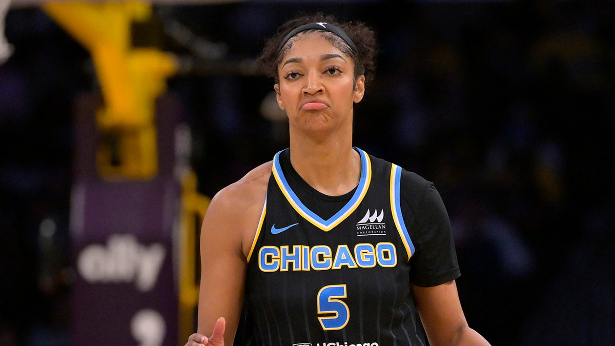 Angel Reese reacts on court