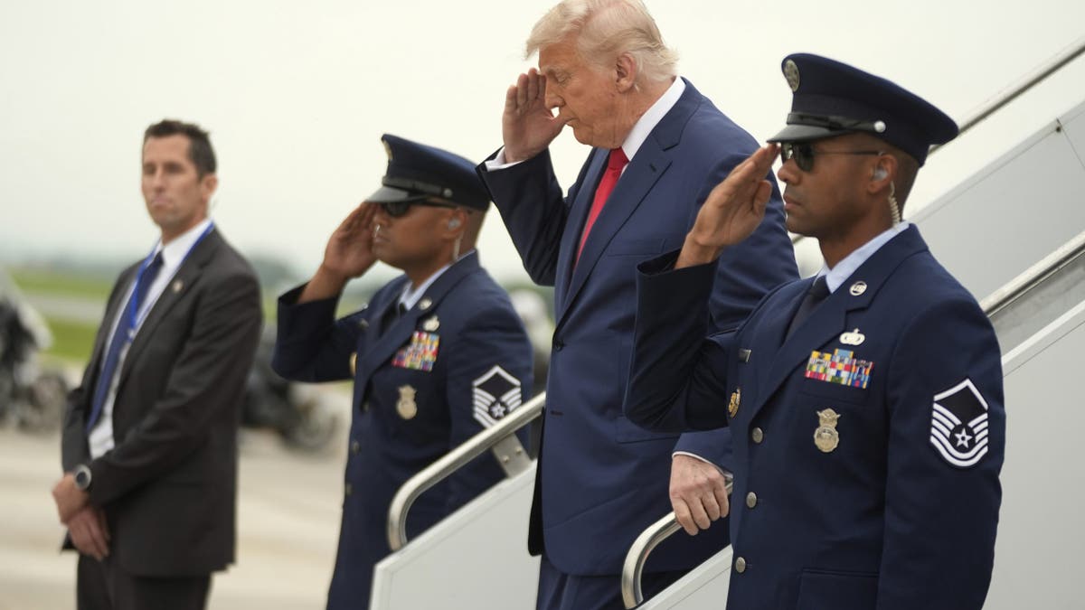 President Donald Trump, center, arrives at Hagerstown Regional Airport in Hagerstown, Maryland, on his way to Camp David on Sunday, June 8, 2025.