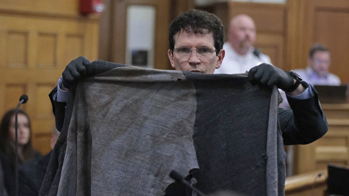 Defense attorney Robert Alessi shows John O'Keefe's hoodie