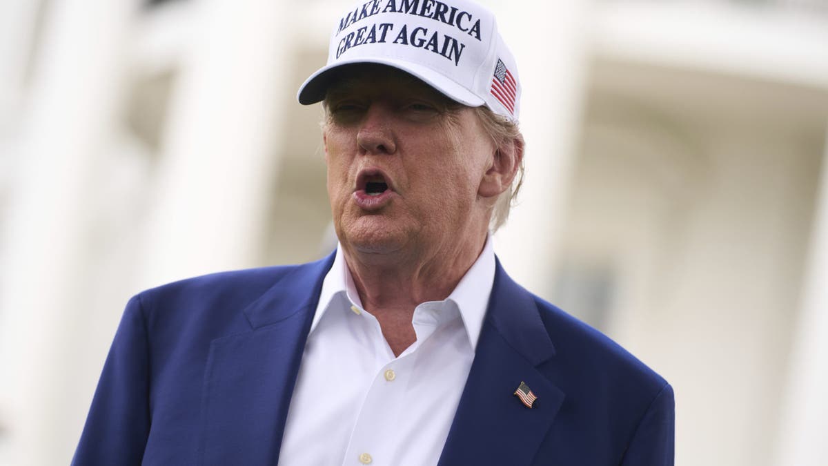 President Donald Trump talks with reporters before a flag pole is installed on the South Lawn of the White House, June 18, 2025 in Washington, D.C.