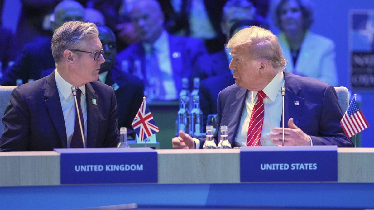 United States President Donald Trump, right, gestures as he speaks to Britain's Prime Minister Keir Starmer at a North Atlantic Council plenary meeting during the the NATO summit in The Hague, Netherlands, Wednesday, June 25, 2025.