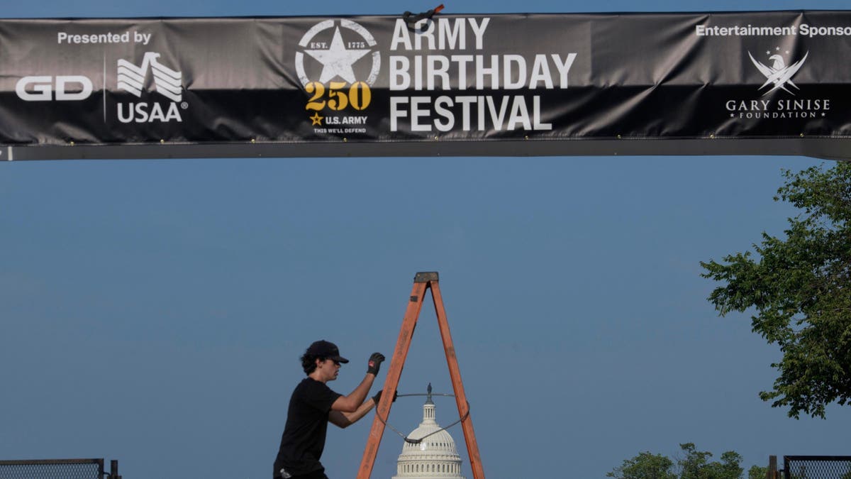 Crews work on setting up an archway on the National Mall, during preparations for an upcoming military parade commemorating the Army's 250th anniversary and coinciding with President Donald Trump's 79th birthday, Thursday, Jun. 12, 2025, in Washington.?