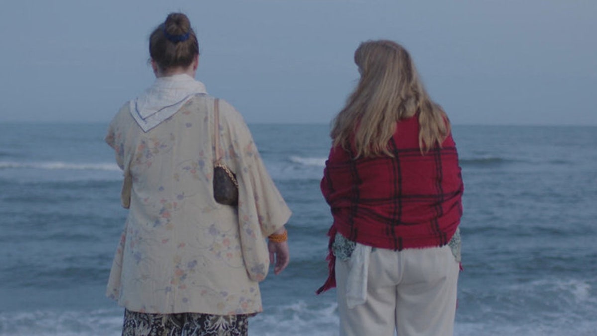 Asa Ellerup standing next to Victoria at Gilgo Beach.