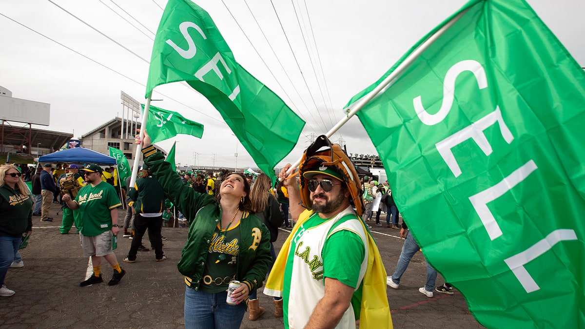 Athletics fans wave 'SELL' flags