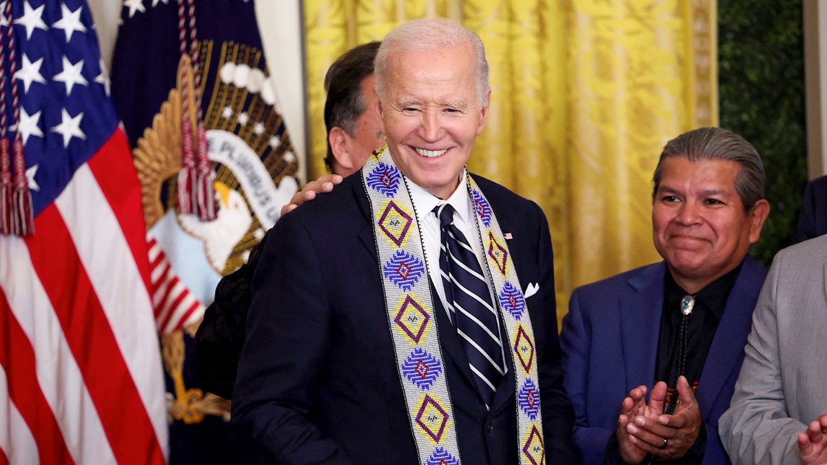 Former President Biden in a ceremonial sash while in office