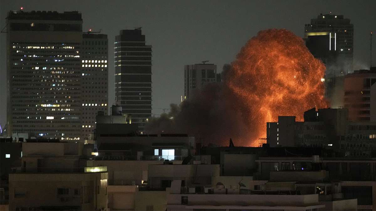 An explosion is seen during a missile attack in Tel Aviv