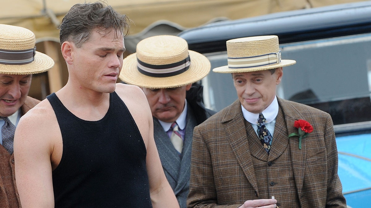 Steve Buscemi wears vintage suit with actor Devin Harjes on Boardwalk Empire film set.