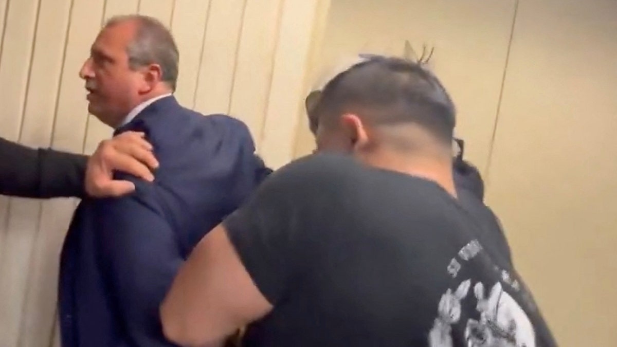 Brad Lander being arrested