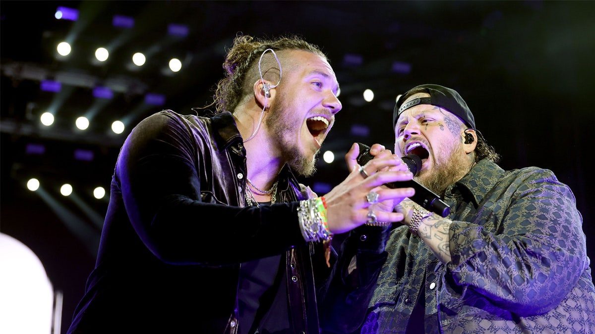 Brandon Lake and Jelly Roll sign together at Stagecoach Festival in California
