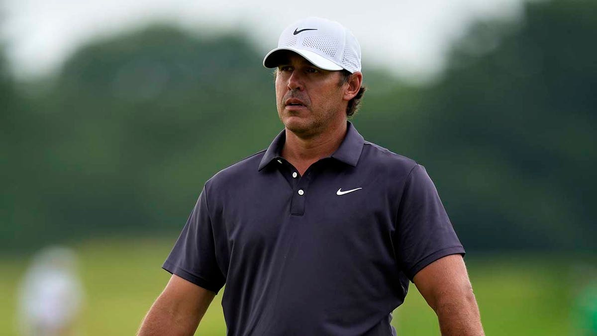 Brooks Koepka looks at