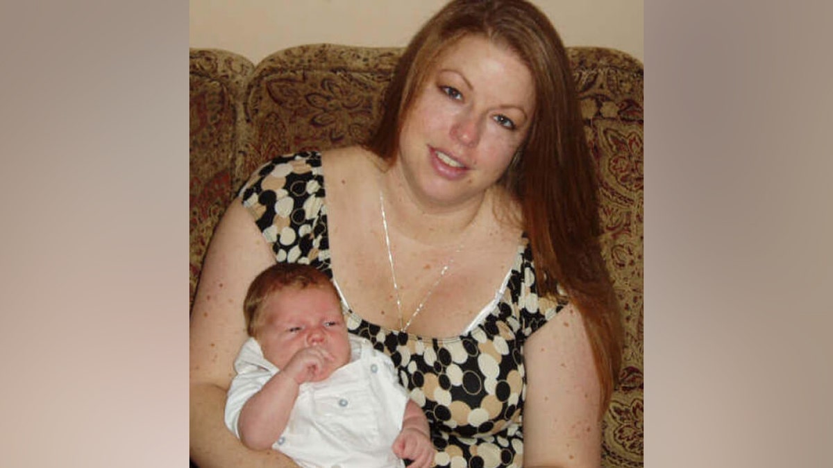 Raelyn Balfour holds her precocious son, Bryce Balfour