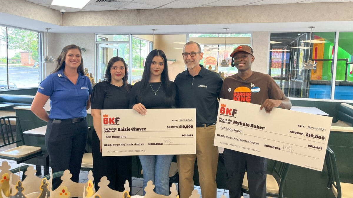 Baker, Mendoza, Chavez smiling with checks