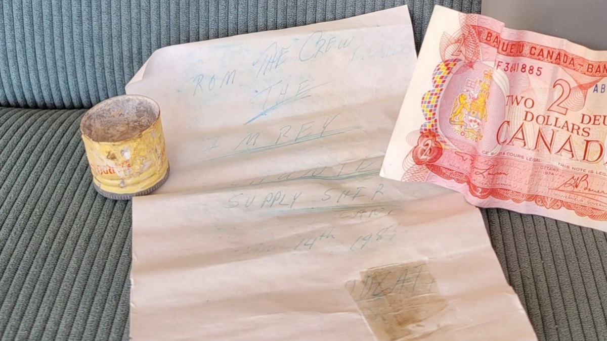 Close-up of faded message in bottle