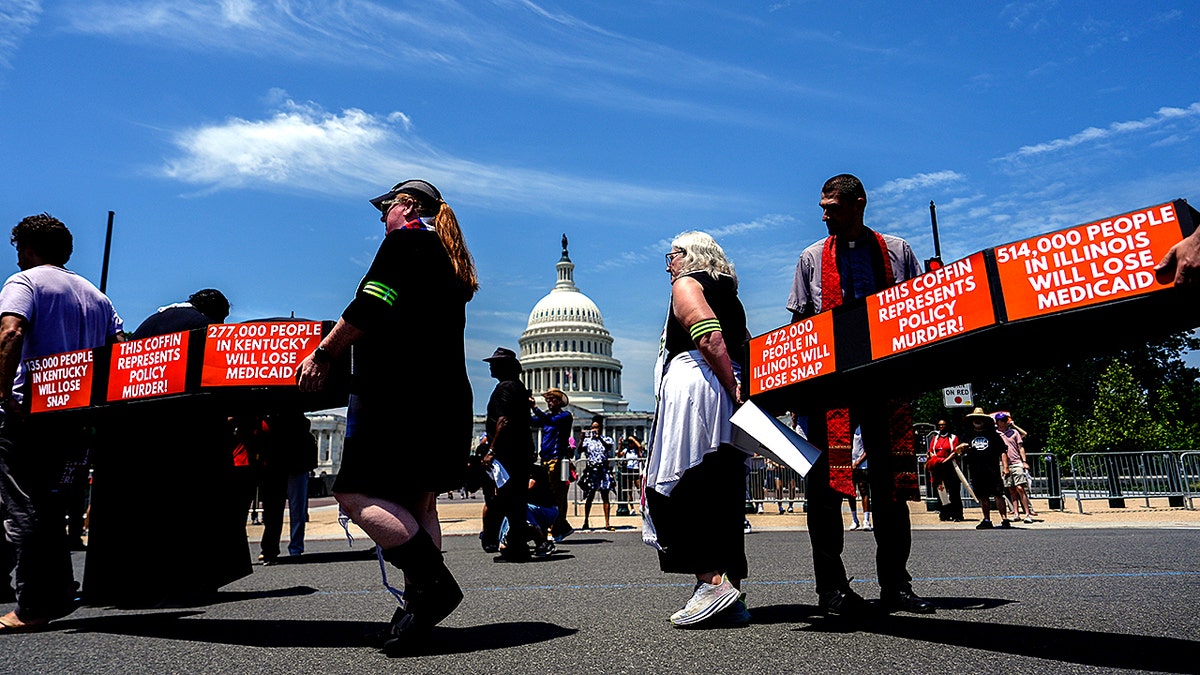 Demonstrators protest at US Capitol carrying coffins