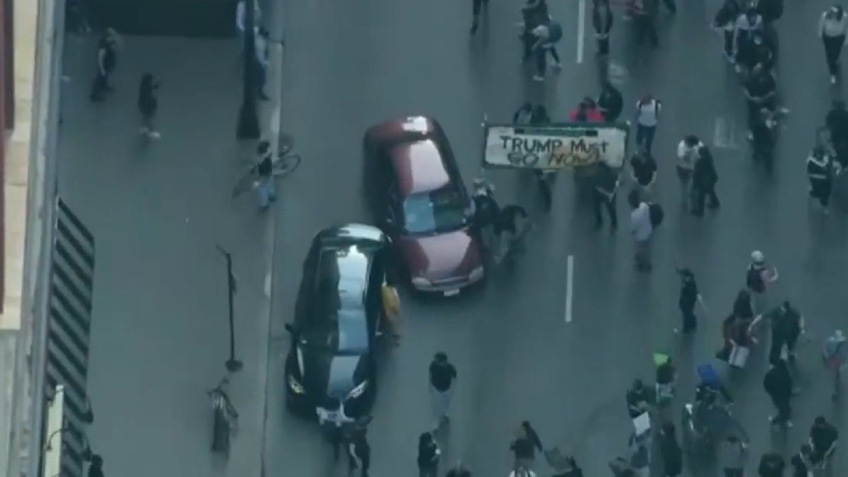 Car plowing through protesters