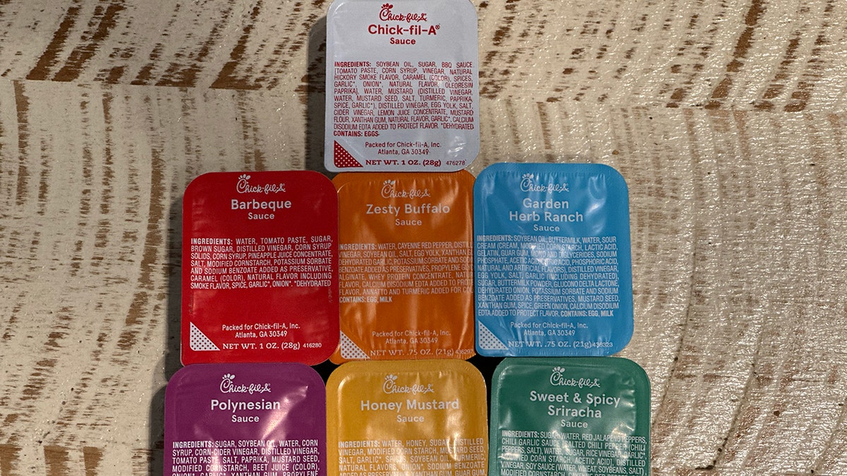 One of each variety of Chick-fil-A sauces is shown on a table.