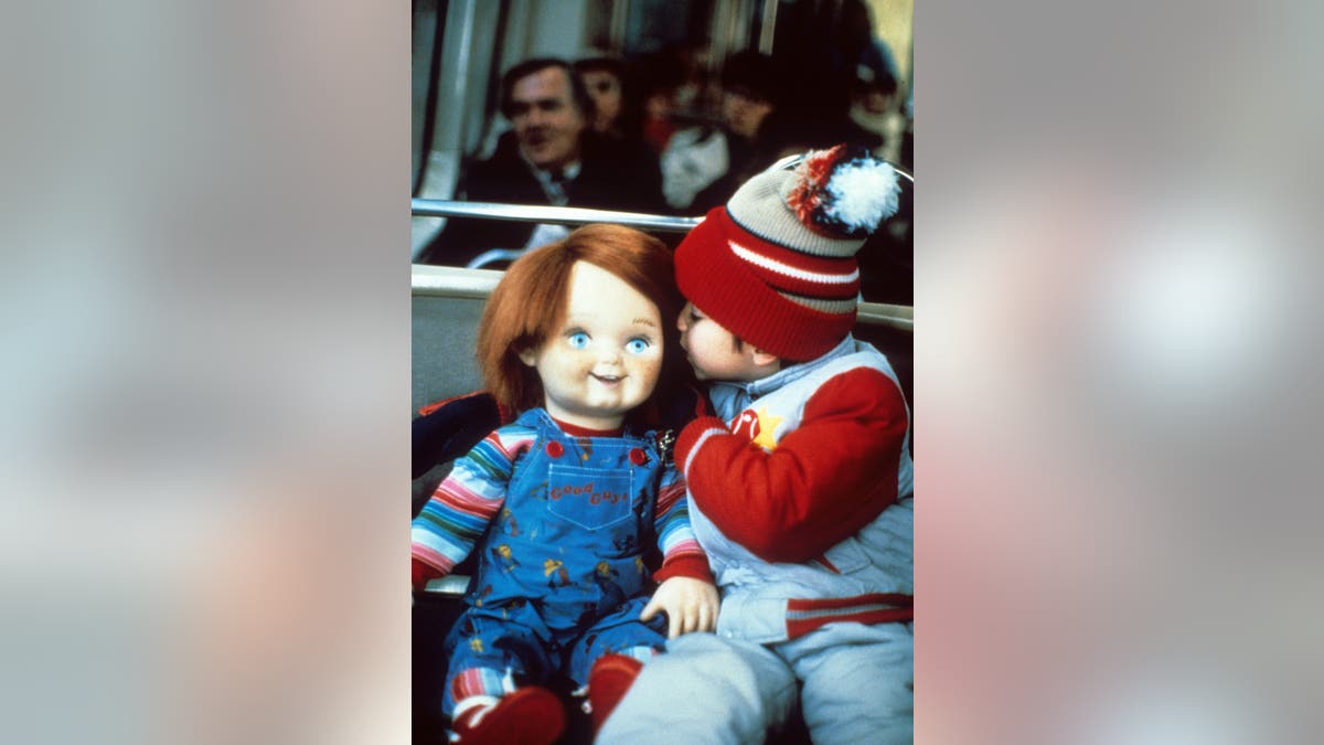 Chucky and Alex Vincent successful a secne from "Child's Play."