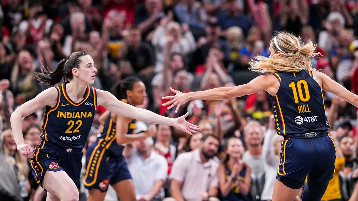 Indiana Fever guard Caitlin Clark (22) and Indiana Fever guard Lexie Hull (10) high-five Saturday, June 14, 2025, during a game against the New York Liberty at Gainbridge Fieldhouse in Indianapolis.