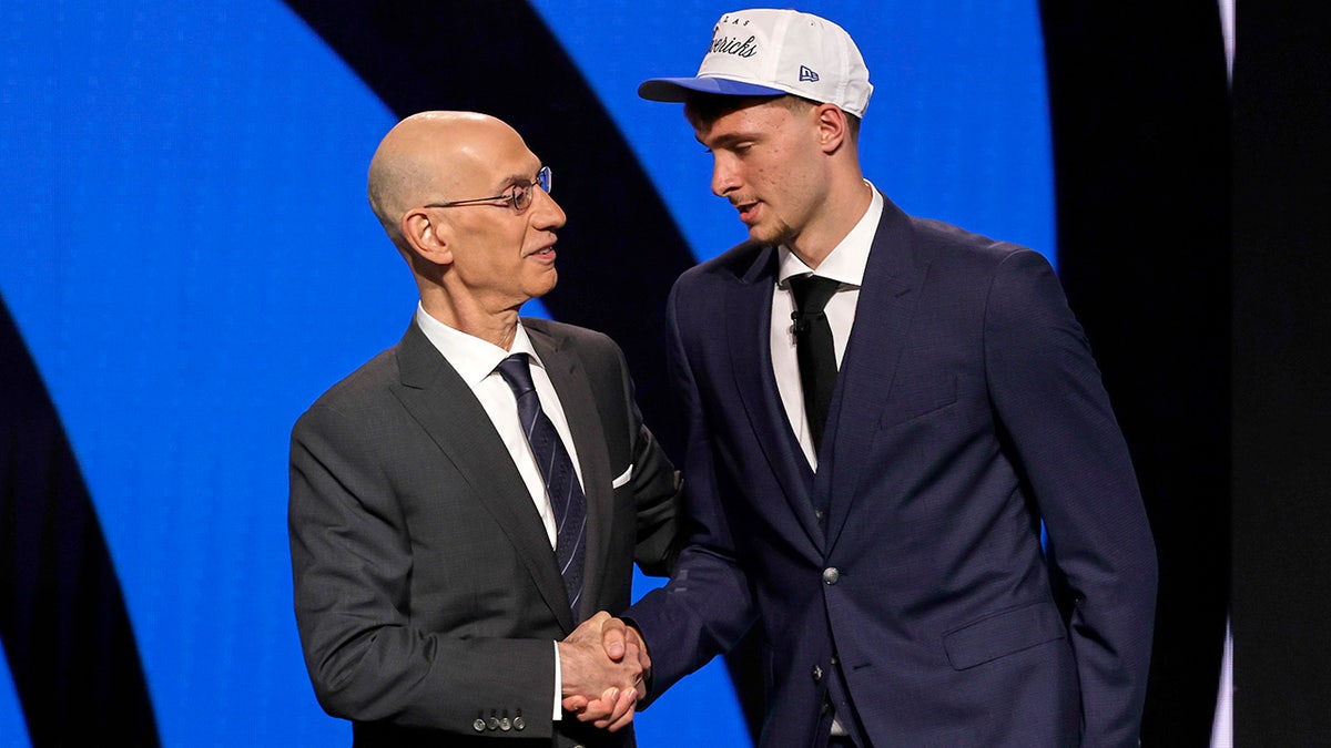Cooper Flagg shakes Adam Silver hand