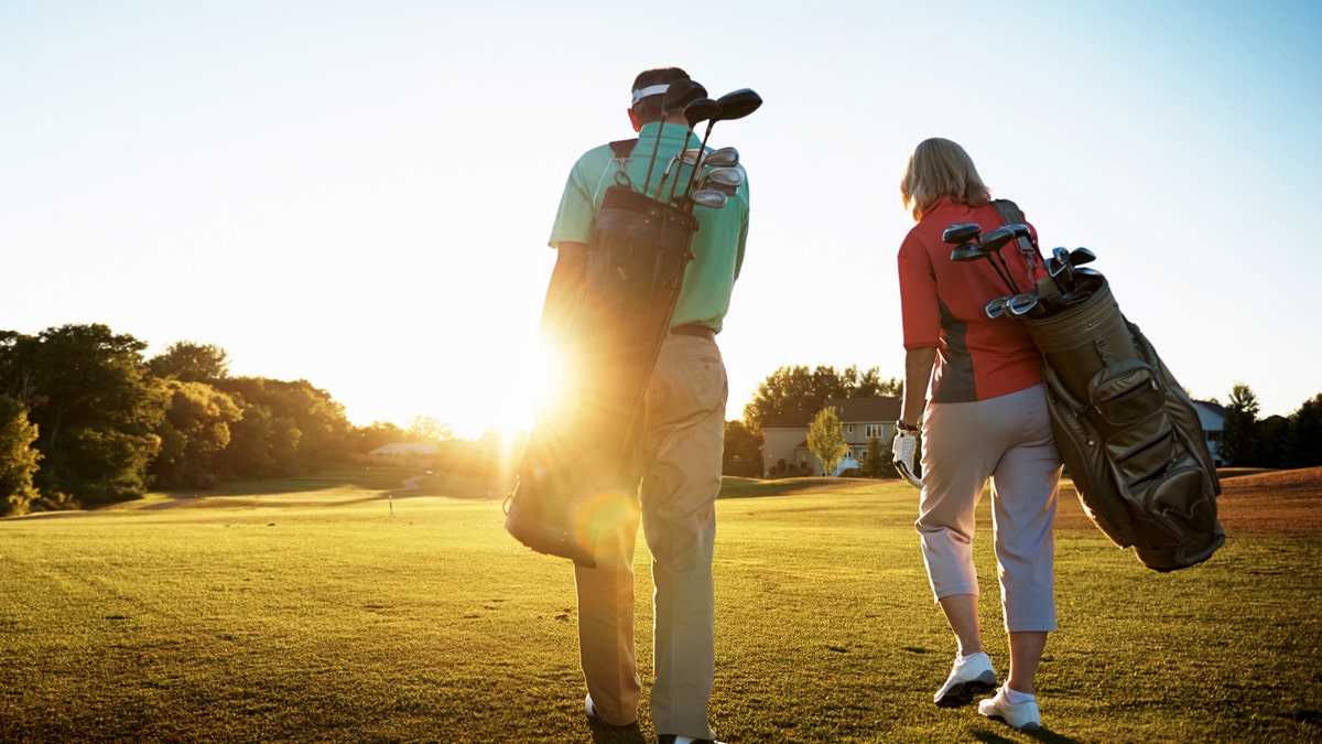 Couple golfing