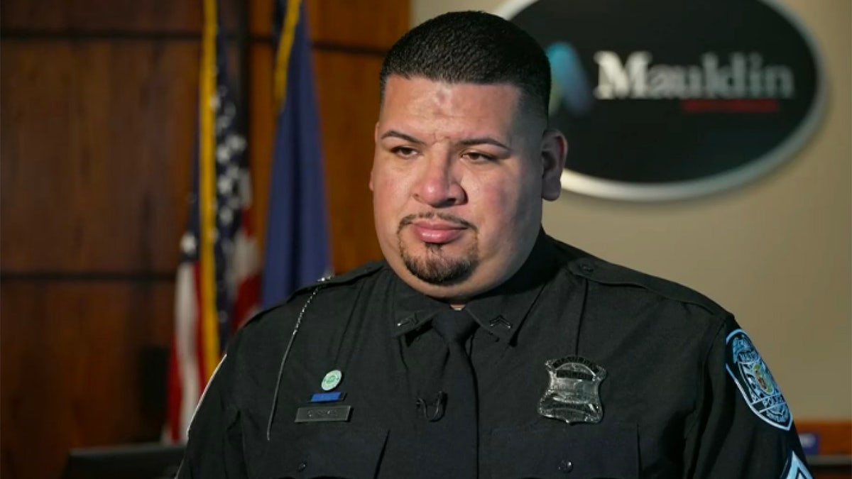 Cpl. Cecilio Reyes of the mauldin police department in police uniform with badge