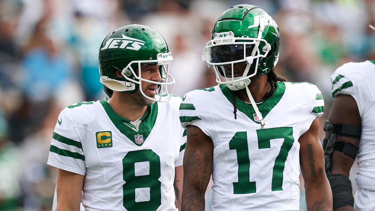 Davante Adams talks with Aaron Rodgers during an NFL game