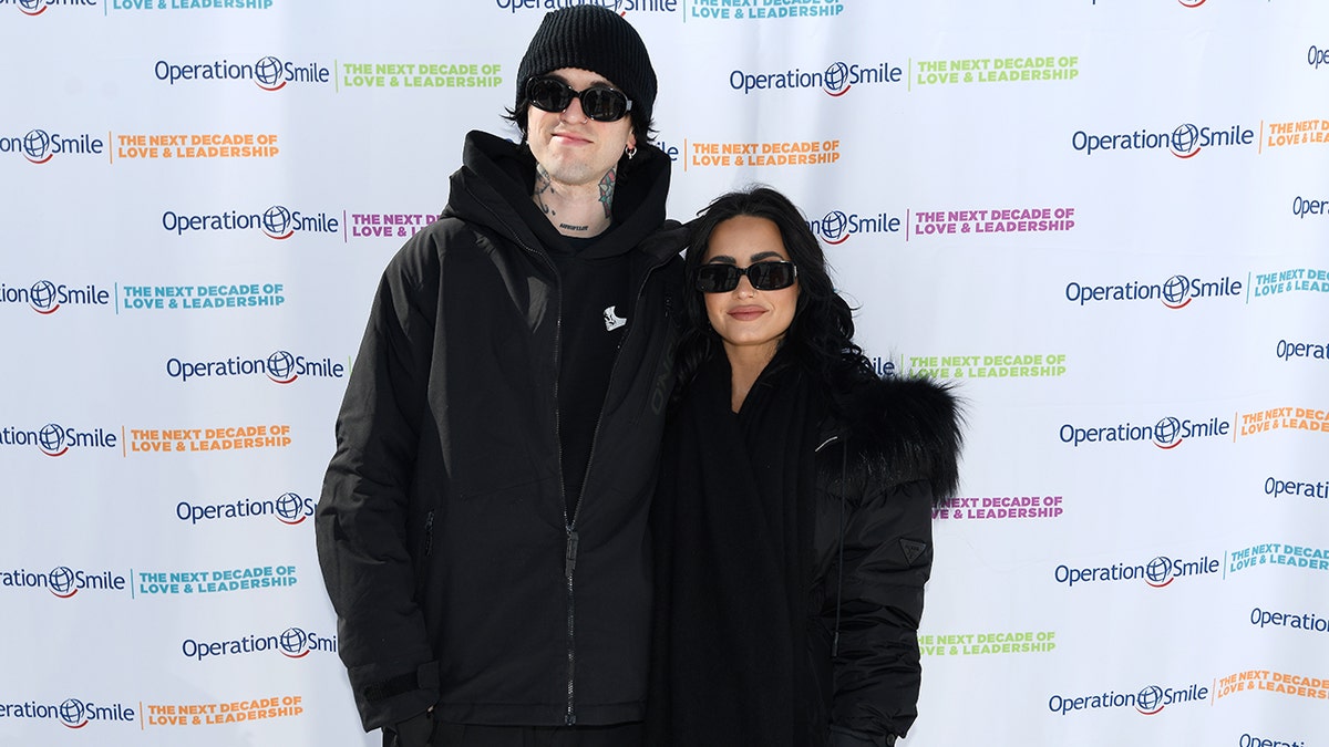 Demi Lovato and Jutes on the Operation Smile red carpet in black outfits.