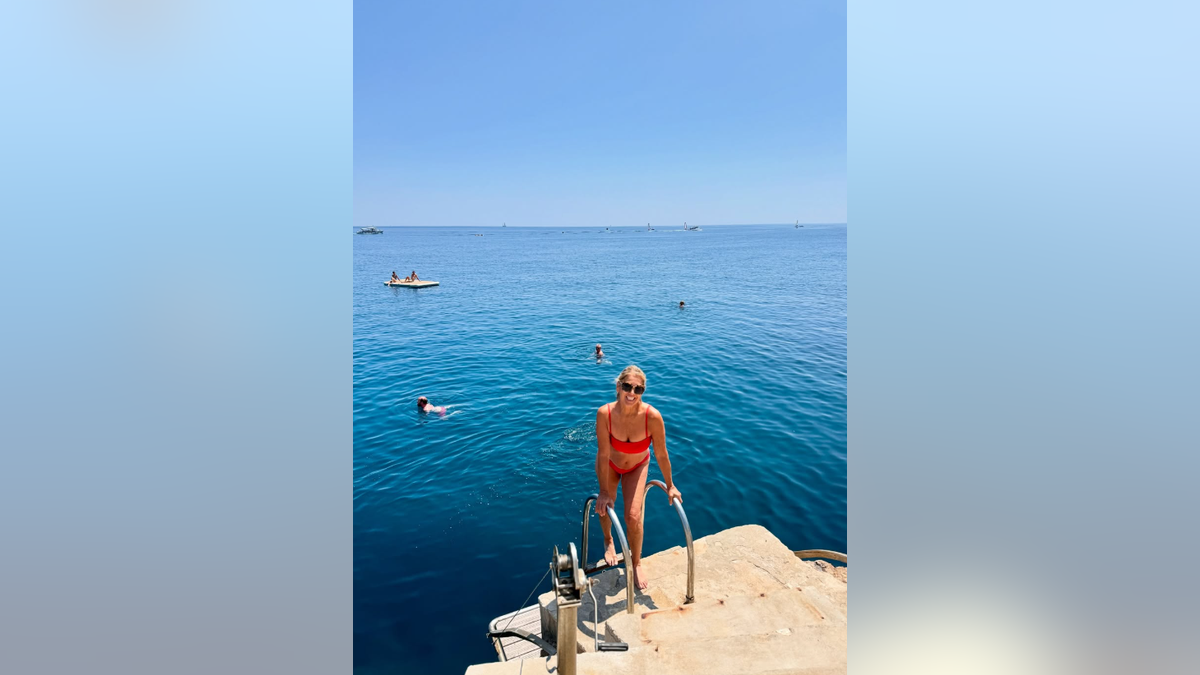 Denise Austin in a red bikini