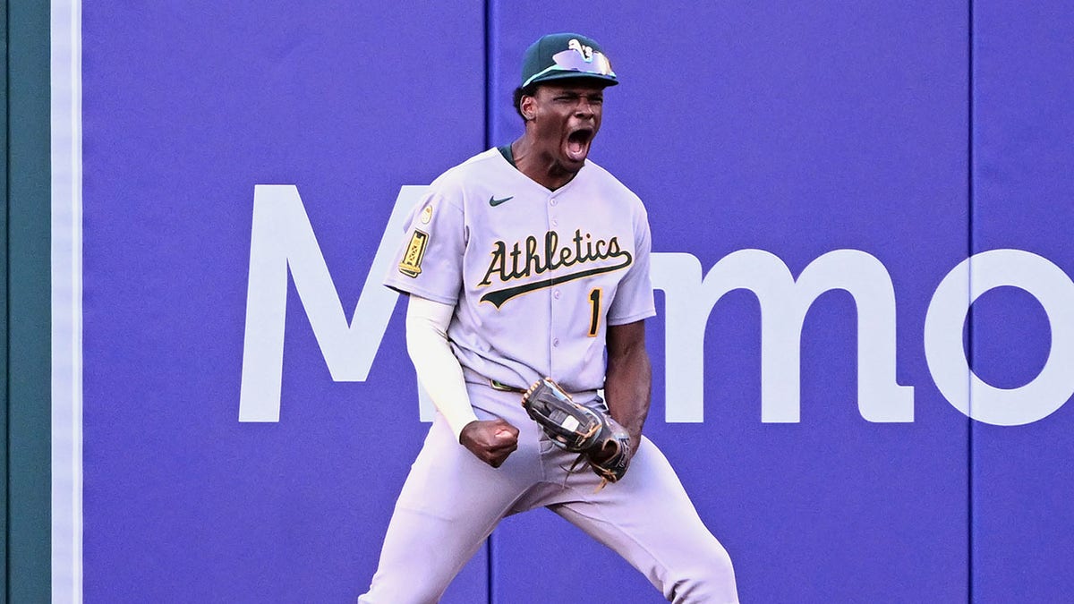 Denzel Clarke celebrates robbing home run