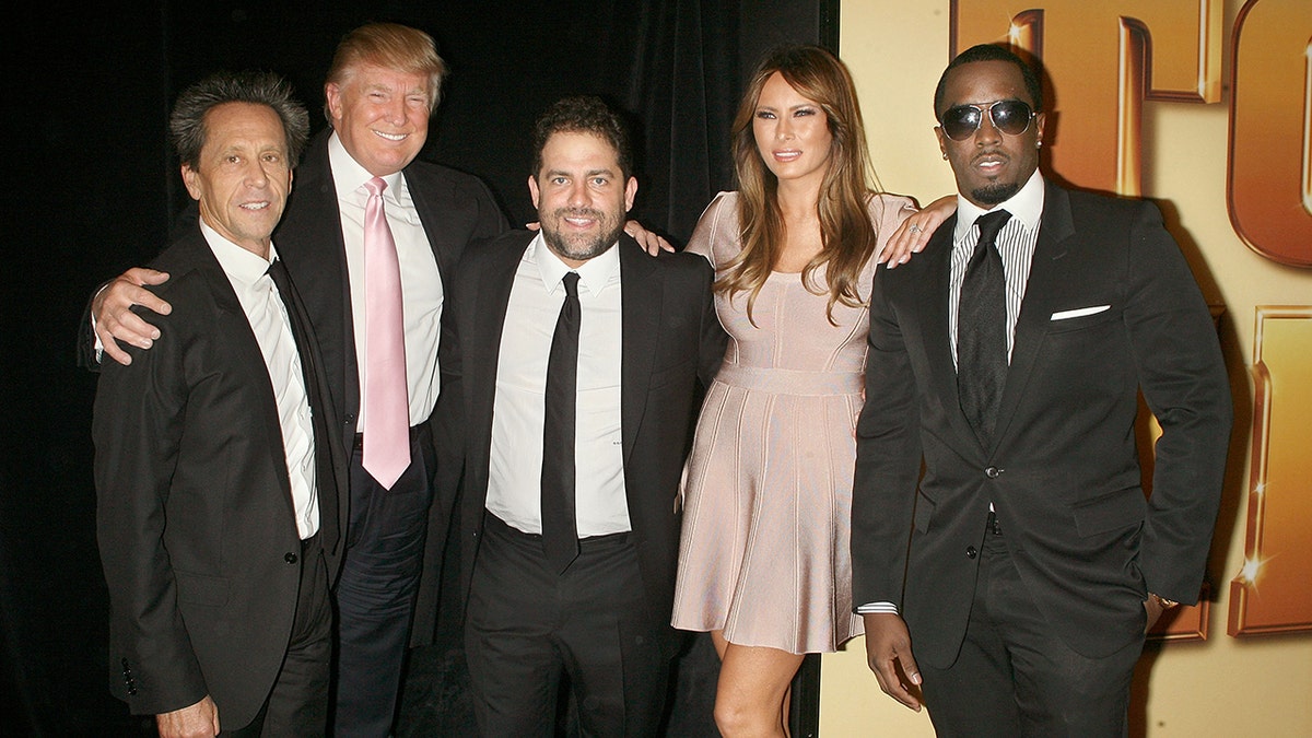 Donald Trump poses with Diddy at a movie premiere