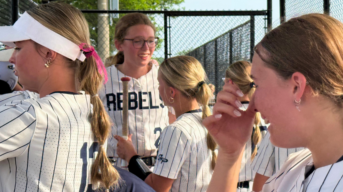 Marissa Rothenberger celebrates in the dugout with teammates after Champlin Park's dramatic win.
