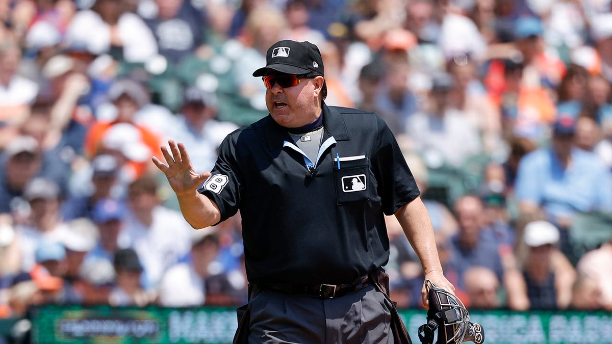 Doug Eddings yells toward dugout