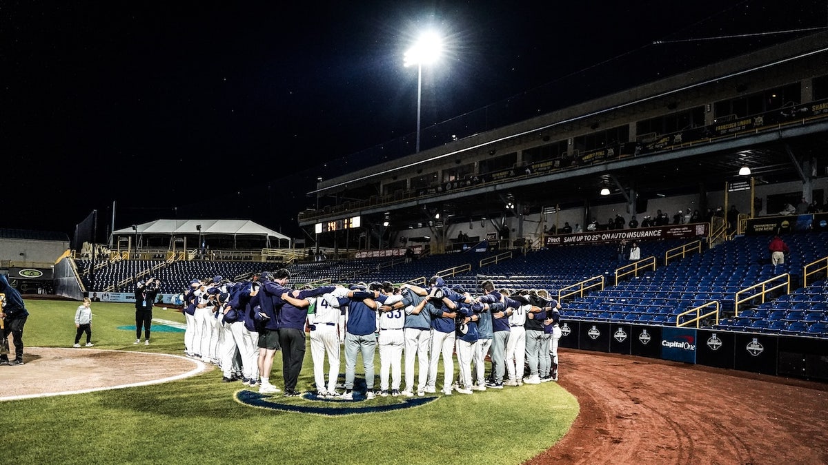 Messiah players connected  the field