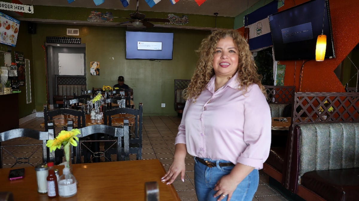 Elizabeth Mendoza, owner of La Ceiba, stands inside her restaurant in Long Beach, California