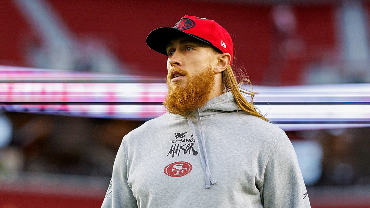 George Kittle walks on field