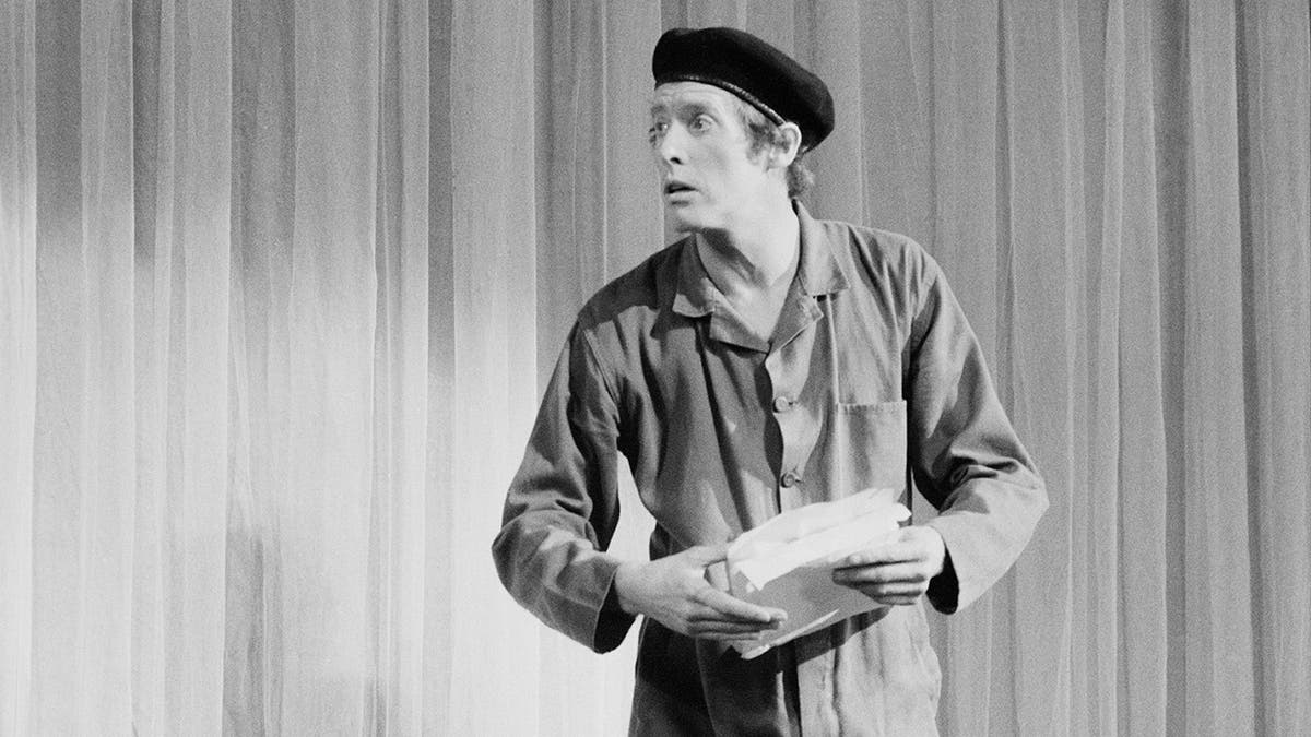 Frank Spencer in costume appearing bewildered.