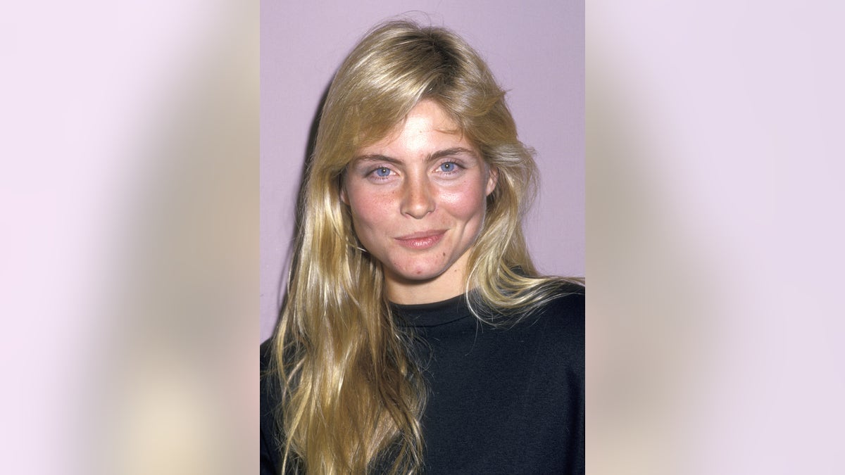 A close-up of Kim Alexis wearing a black sweater.
