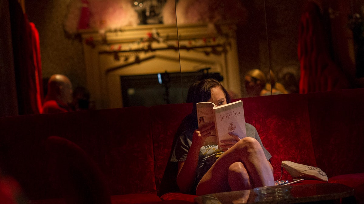 Woman reading a book at Moonlight Bunny Ranch