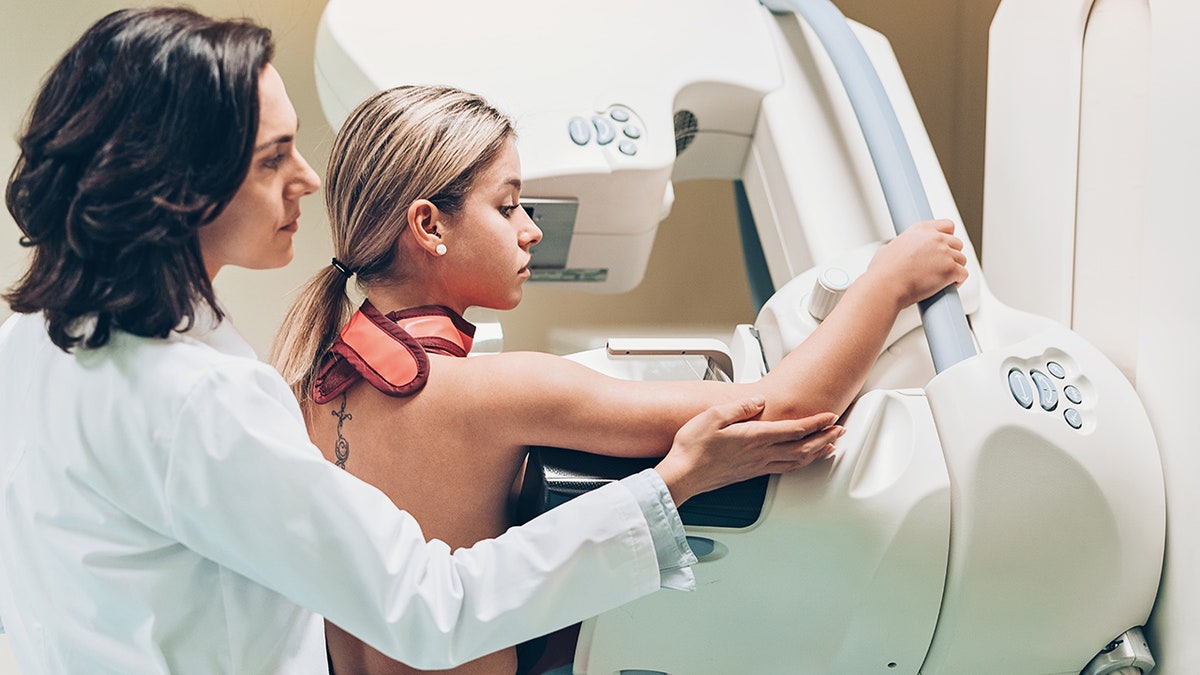 doctor with patient at mammogram