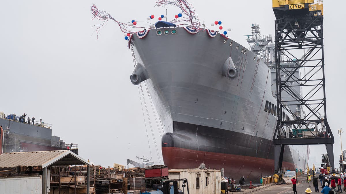 USNS Harvey Milk departs the General Dynamics NASSCO shipyard after a ceremonial address in San Diego, California on November 6, 2021.