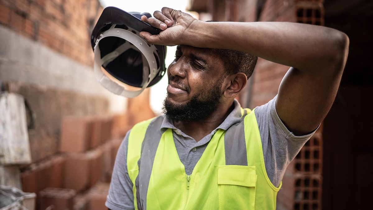 Exhausted construction worker