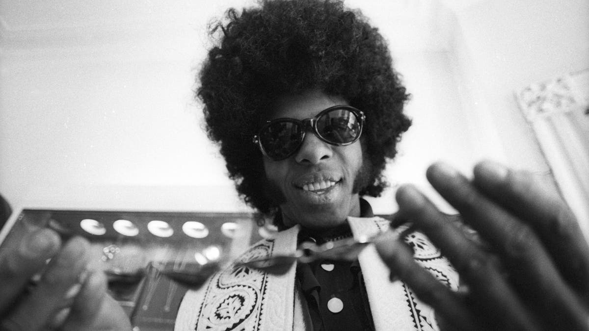 Sly Stone smiling