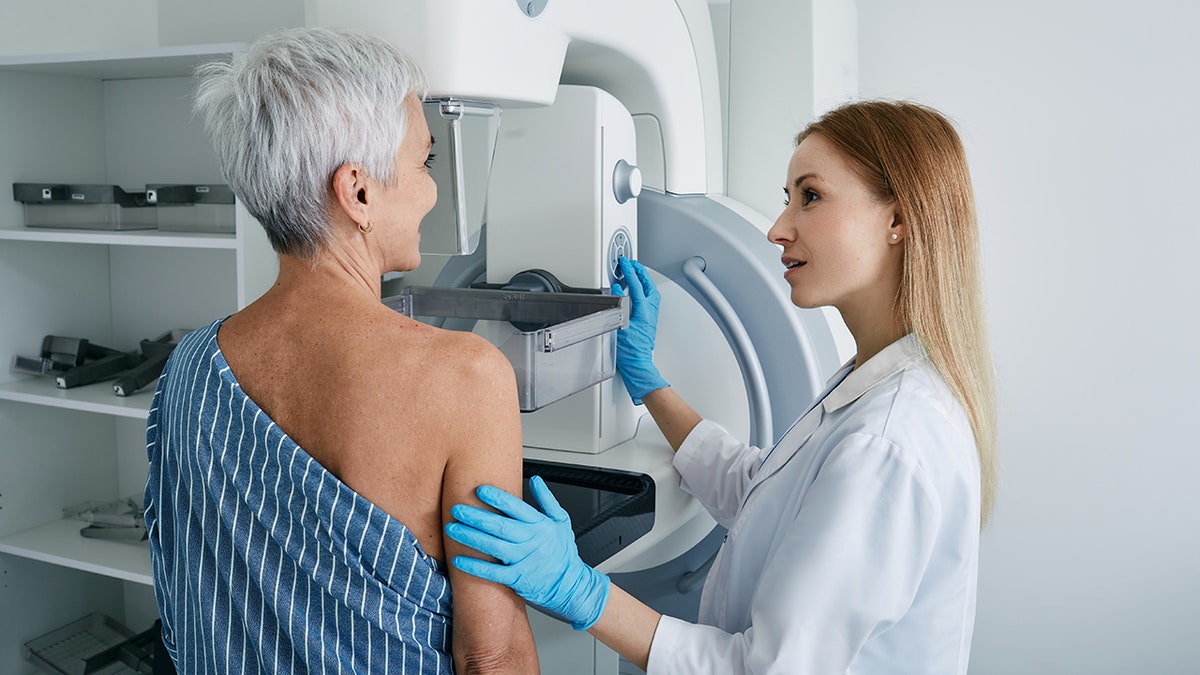 senior woman gets mammogram