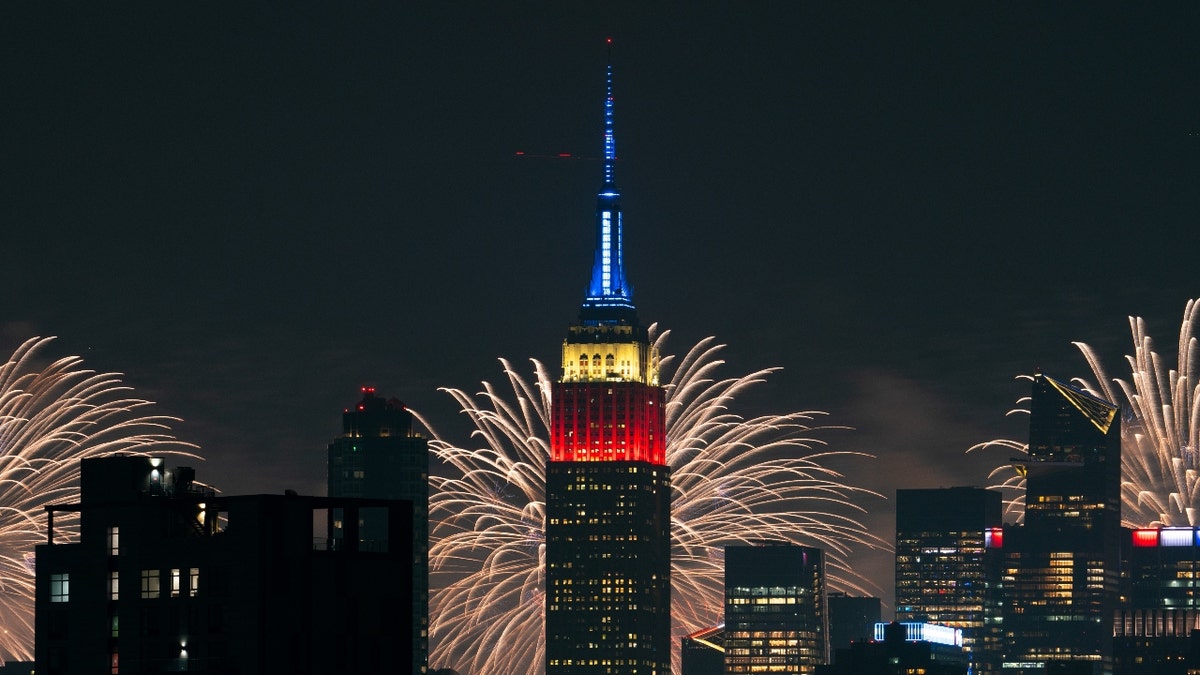 The Macy's 4th Of July fireworks show lights up the night sky as a backdrop to the Empire State Building on July 4, 2024 in New York City. The annual spectacle, lighting up the city since 1976, this time was launched from barges in the Hudson River, the first time in more than a decade not done from the East River.