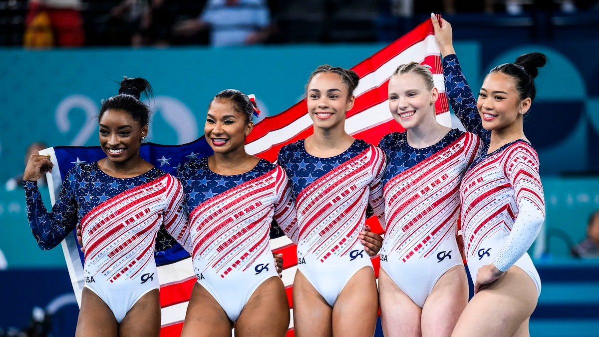 From left to right, Simone Biles, Jordan Chiles, Hezly Rivera, Jade Carey and Sunisa Lee of Team United States celebrate winning the gold medal after the Artistic Gymnastics Women's Team Final on day four of the Olympic Games Paris 2024 at the Bercy Arena on July 30, 2024 in Paris.