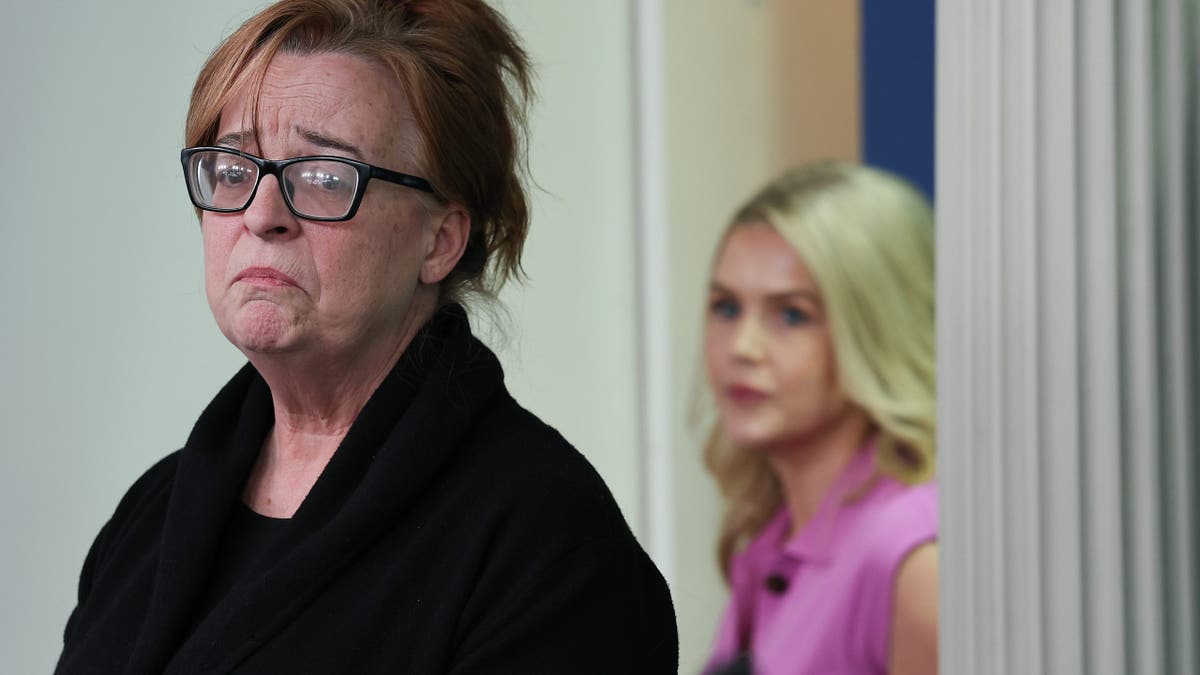 WASHINGTON, DC - APRIL 16: Patty Morin (L), mother of Rachel Morin, speaks as White House Press Secretary Karoline Leavitt looks on during a daily press briefing in the Brady Press Briefing Room at the White House on April 16, 2025 in Washington, DC. In 2023, Morin's daughter was murdered by Victor Martinez-Hernandez, an illegal immigrant from El Salvador who was convicted of first-degree murder and first-degree rape on Monday. During the briefing, Leavitt addressed the Trump administration's illegal deportation of Kilmar Armando Abrego Garcia, a Maryland man who has been held in prison in El Salvador since March 15. (Photo by Win McNamee/Getty Images)