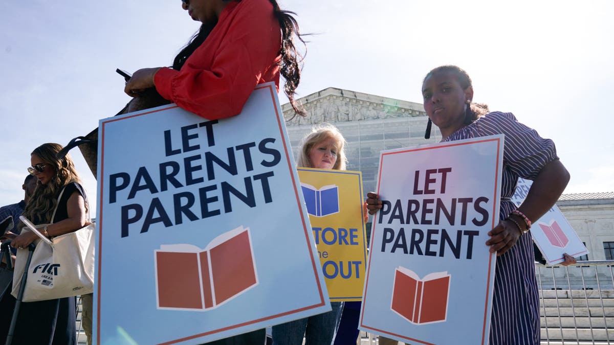 Parents and activists keep reading signs