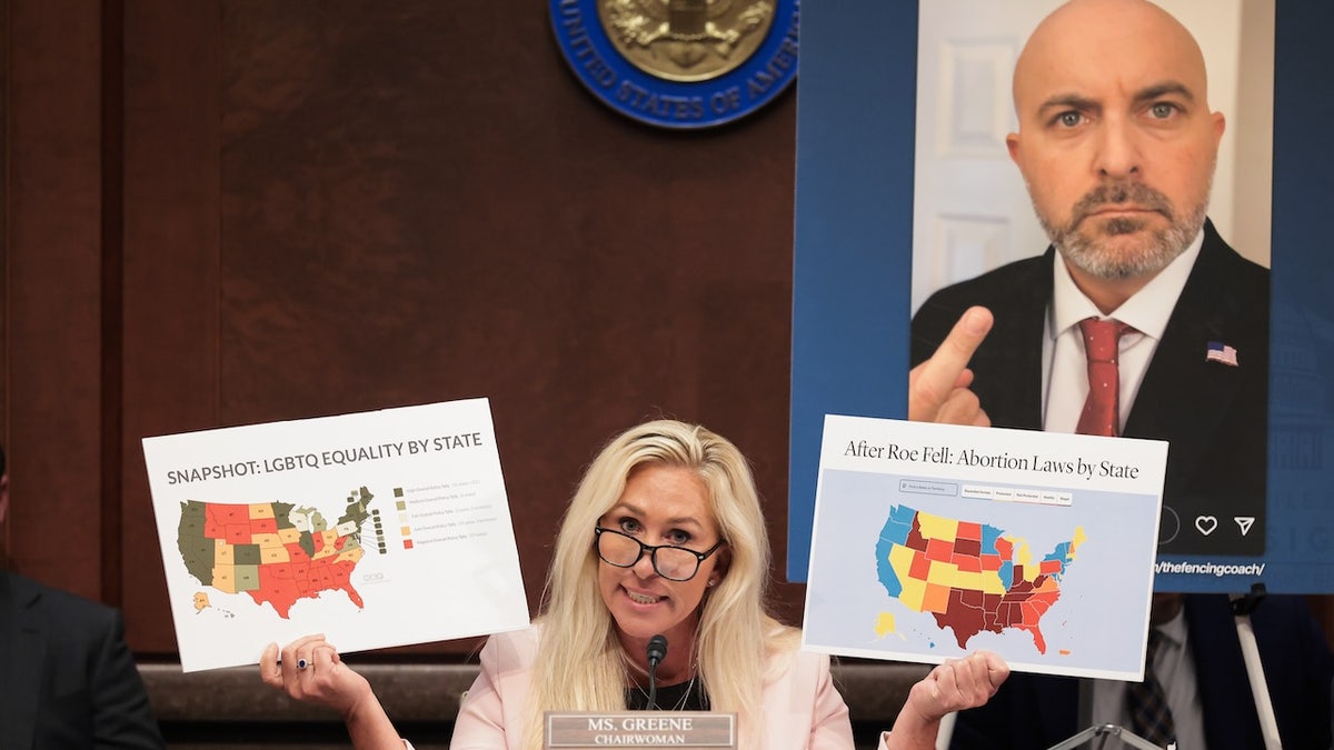 Marzhori Taylor Green (R-GA) reporter holds US cards in front of a screenshot from US Fencing Council "Unjust game: avoid men from women's sports" On May 7, 2025, the Government Subcommittee is held in the US Capitol.