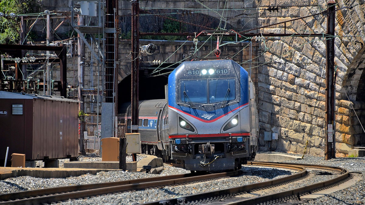 amtrak train emerging from baltimore potomac tunnel